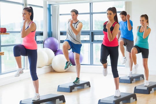 A group of fitness enthusiasts performing Aerobics